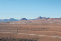 Figure 2. The view toward the array center from Cerro Chico.  The Technical Buildings are to the left; the Cosmic Background Imager facility is to the right.  Photo by A. Beelen.