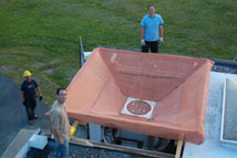 Figure 1: The phased array receiver and ground screen mounted in the Green Bank Indoor/Outdoor test facility.  Clockwise from top are BYU students Jacob Waldron, Jonathan Landon, and Jiyoung Son.