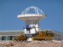 Figure 1. Antenna transporter Lore moves a Vertex antenna past the OSF Technical Buildings to a testing site.