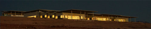 Figure 2. Work continues past sunset in the new OSF Technical Building, seen here just before drawing of the nightshades.
