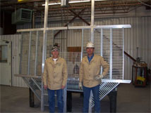 This photo shows Tommy Montoya and Adrian Zamora of the VLA Weld Shop with the last EVLA feed cone floor, #28