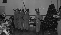 Children's  holiday parties, held annually at all sites, are a long tradition at NRAO. In  this photo from the 1977 party in Green Bank, Santa and his reindeer make their  grand entrance.