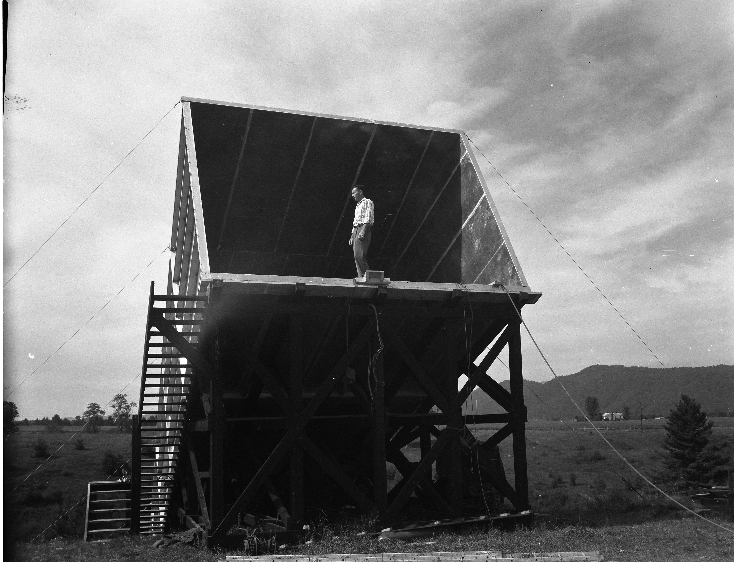 	Warren Wooddell standing in the completed Calibration Horn Antenna, 1959