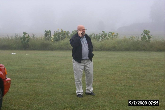 [Doc Ewen discussing foggy conditions with pilot]