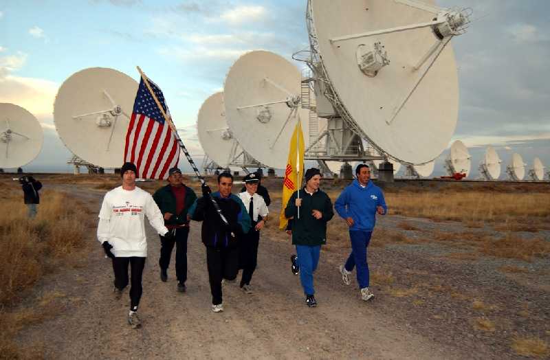 Runners Carry U.S. and New Mexico Flags at the VLA
